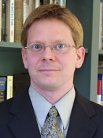 [Photo of Andrew J. Coulson]